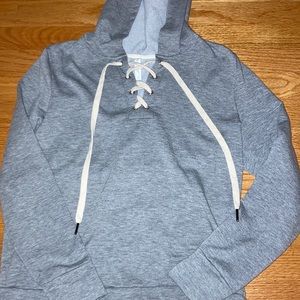 Grey hoodie with cross strings in front